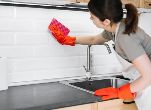 woman-cleaning-with-rag_23-2148520996